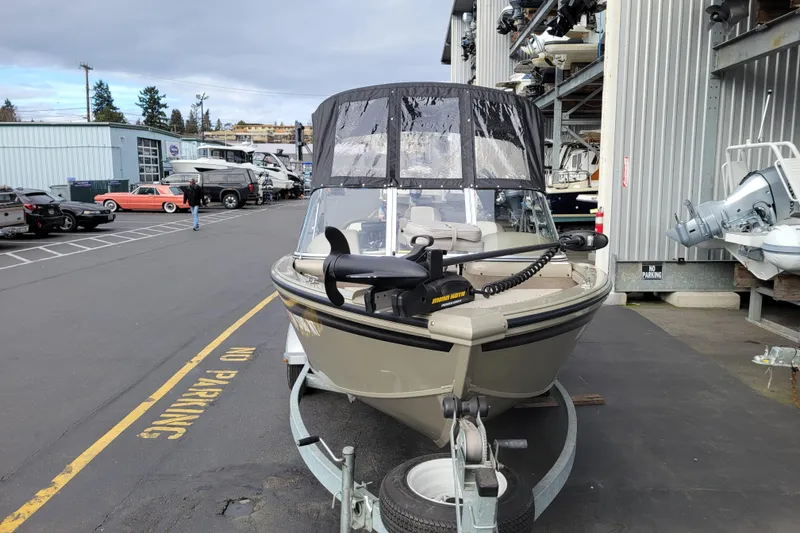 Slide: The Image of 2005 Lowe Fish & Ski 165 boat on trailer at marina, overcast day. - 17