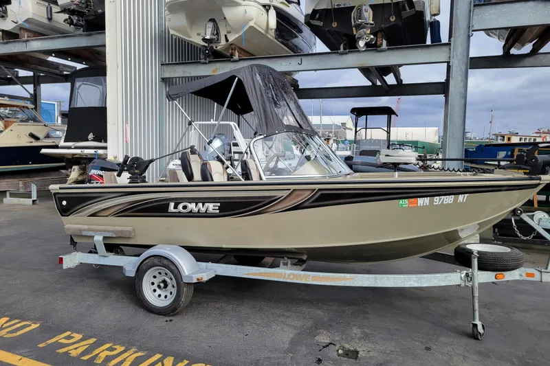 Slide: The Image of 2005 Lowe Fish & Ski 165 boat on trailer in marina storage area. - 18