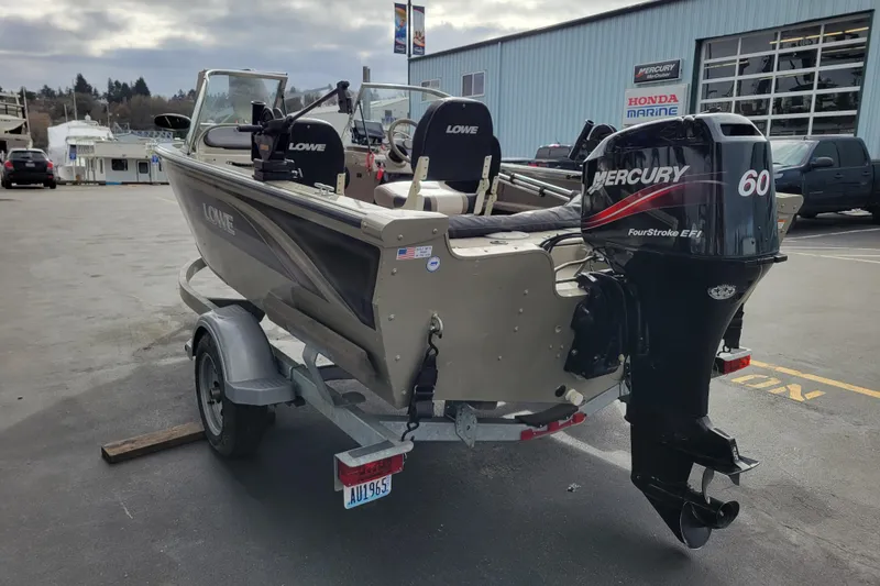Slide: The Image of 2005 Lowe Fish & Ski 165 boat with Mercury 60 engine on trailer. - 2