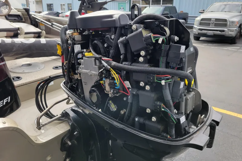 Slide: The Image of 2005 Lowe Fish & Ski 165 boat engine with exposed wiring and components. - 27