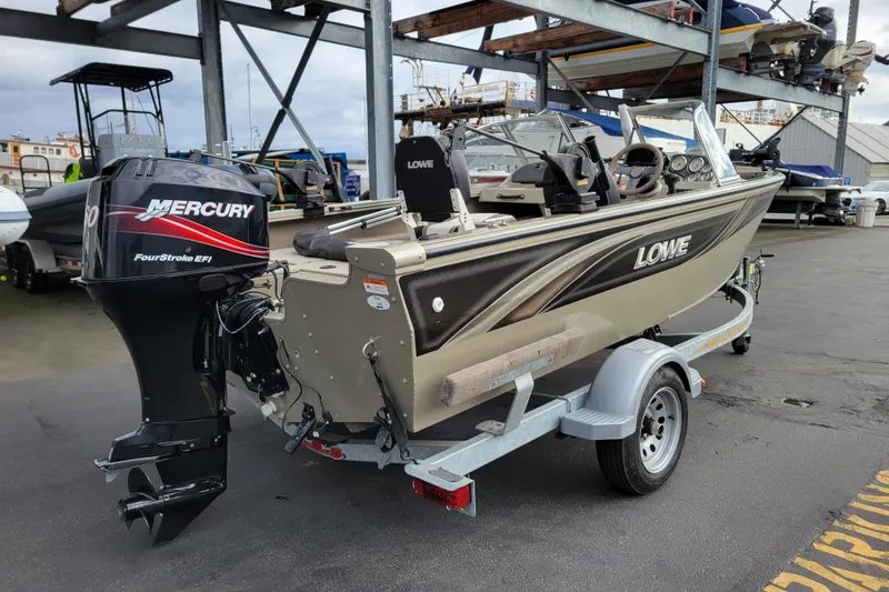 Slide: The Image of 2005 Lowe Fish & Ski 165 boat with Mercury FourStroke EFI engine on trailer. - 4