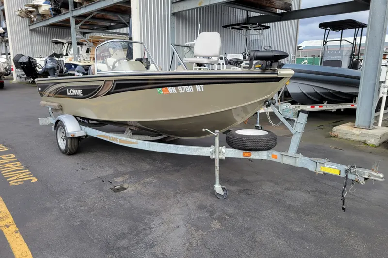 Slide: The Image of 2005 Lowe Fish & Ski 165 boat on trailer in marina storage area. - 6