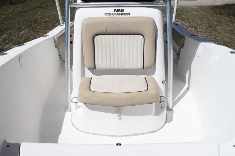 Slide: The Image of 2016 Sea Fox 186 Commander boat interior with beige seating and console. - 16
