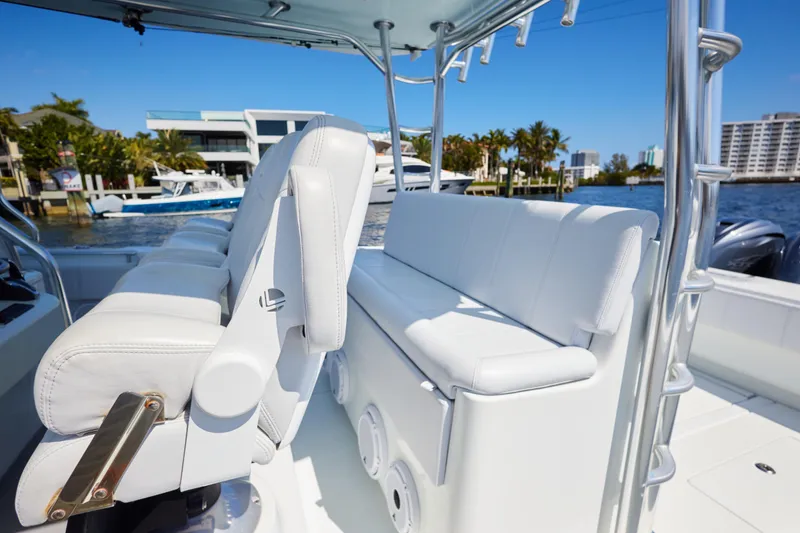 Slide: The Image of 2022 Contender 44 Fisharound boat with white seating and sleek design on a sunny day. - 14