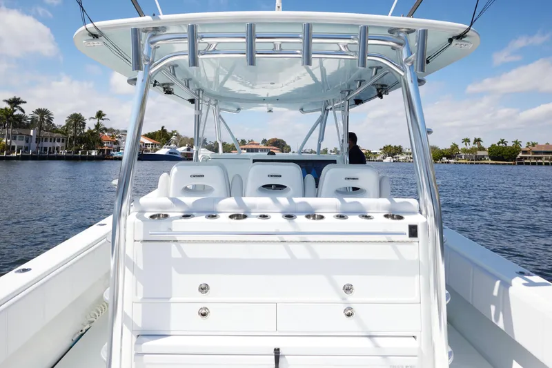 Slide: The Image of 2022 Contender 44 Fisharound boat on water, featuring sleek design and spacious deck. - 16