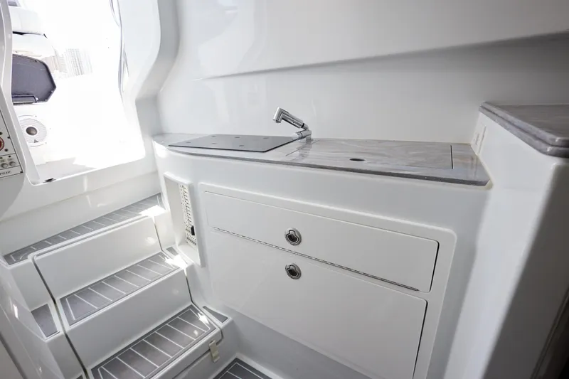 Slide: The Image of 2022 Contender 44 Fisharound interior with sleek cabinetry and modern design. - 18