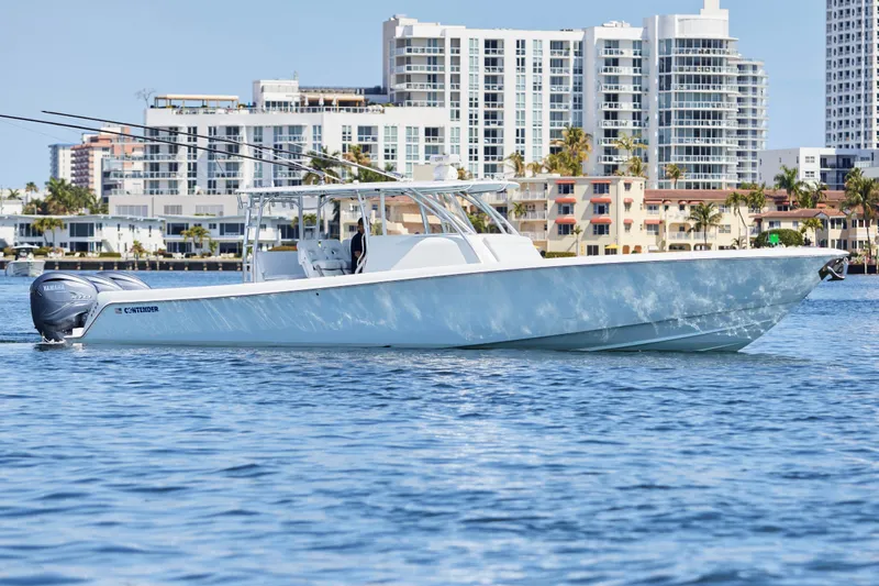 Slide: The Image of 2022 Contender 44 Fisharound boat on water with city skyline background. - 5
