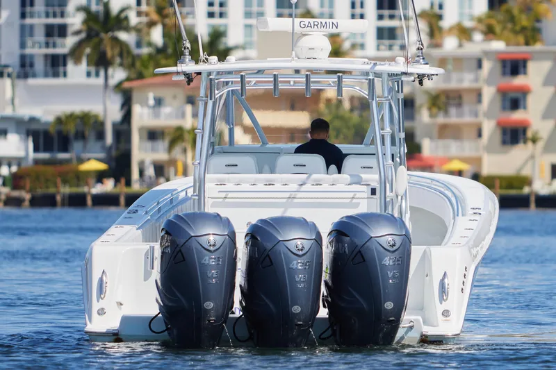 Slide: The Image of 2022 Contender 44 Fisharound boat with triple Yamaha engines on the water. - 7