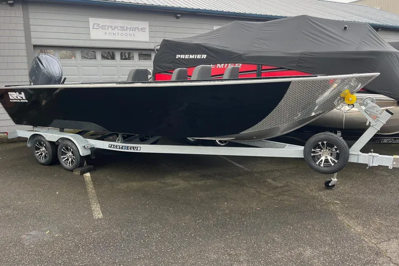 Slide: The Image of RH Boats 23 Commander 2026 on trailer, close-up of bow. - 10