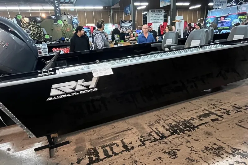 Slide: The Image of 2026 RH Boats 23 Commander with diamond plate deck and storage compartments. - 5