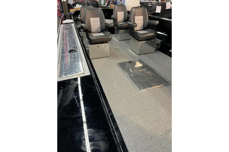 Slide: The Image of 2026 RH Boats 23 Commander with Yamaha outboard motor and diamond plate storage compartments. - 7