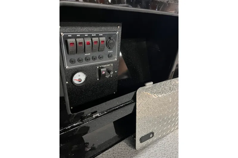 Slide: The Image of 2026 RH Boats 23 Commander with Yamaha outboard motor, docked near a building. - 8