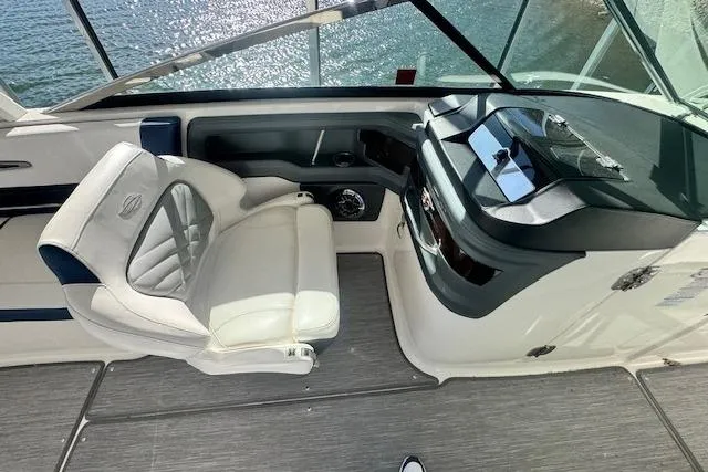 Slide: The Image of 2021 Chaparral 307 SSX boat cockpit with luxurious seating and modern dashboard. - 10