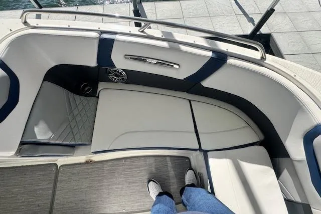 Slide: The Image of 2021 Chaparral 307 SSX boat interior with cushioned seating and modern design. - 19