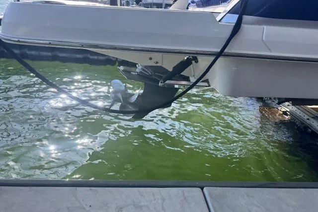 Slide: The Image of 2021 Chaparral 307 SSX boat stern and propeller in water. - 31