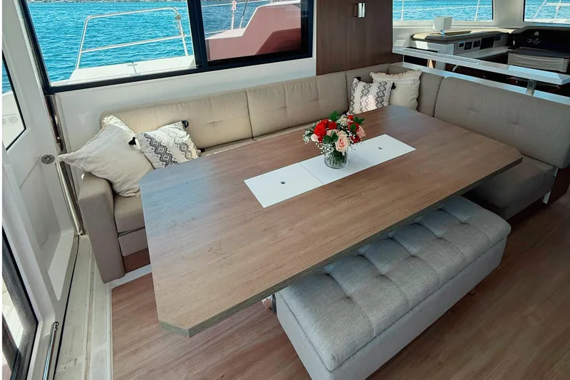 Slide: The Image of Luxurious interior of 2023 Bali CATSPACE yacht with elegant dining area and sea view. - 16