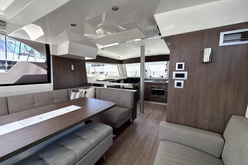 Slide: The Image of Luxurious interior of 2023 Bali CATSPACE catamaran with modern seating and kitchen area. - 18