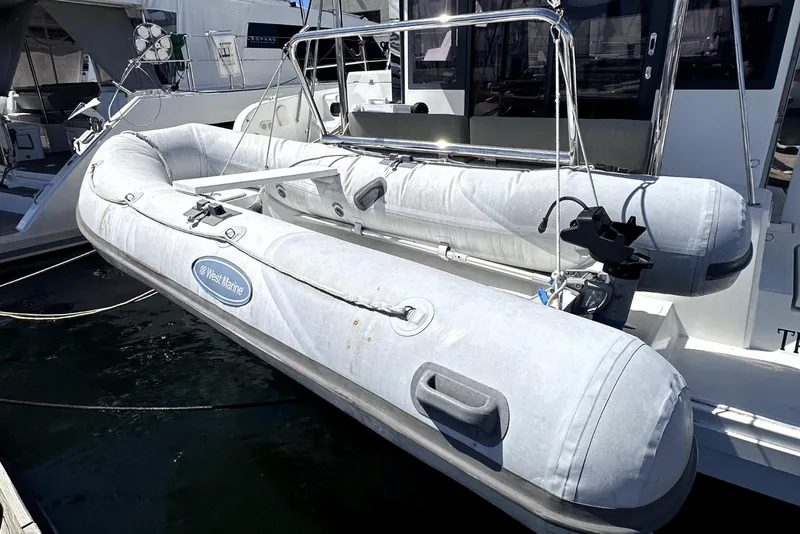 Slide: The Image of Inflatable boat on 2023 Bali CATSPACE catamaran, docked at marina. - 35