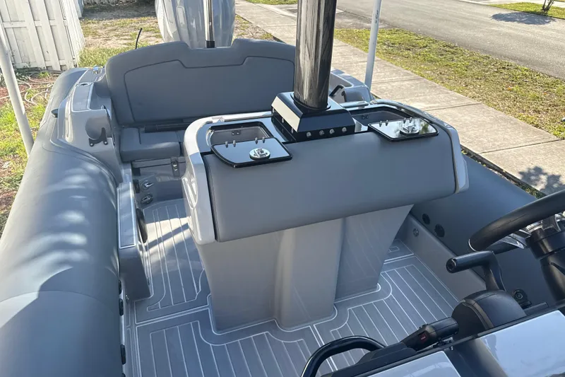 Slide: The Image of Boat interior with sleek design, featuring Ribeye HFM model, 2022, in a sunny neighborhood setting. - 16