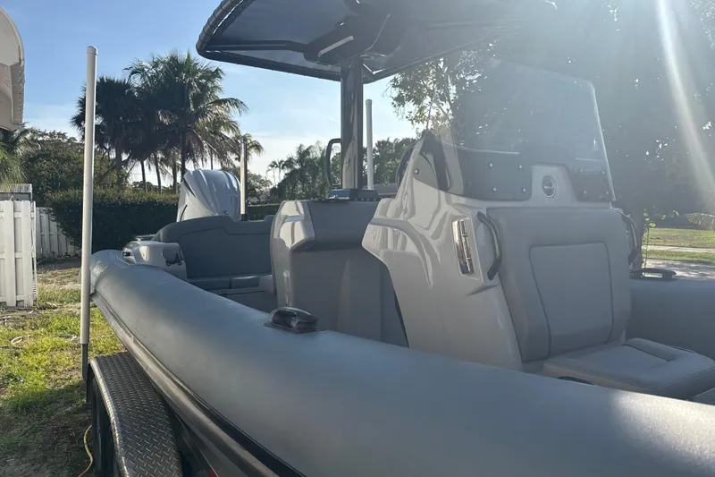 Slide: The Image of Boat console with dual Garmin displays, steering wheel, and Ribeye branding, model HFM 2022. - 2