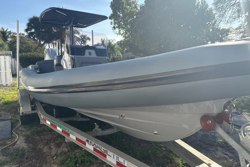 Slide: The Image of 2022 Ribeye HFM boat interior with gray cushioned seating and sleek design. - 3