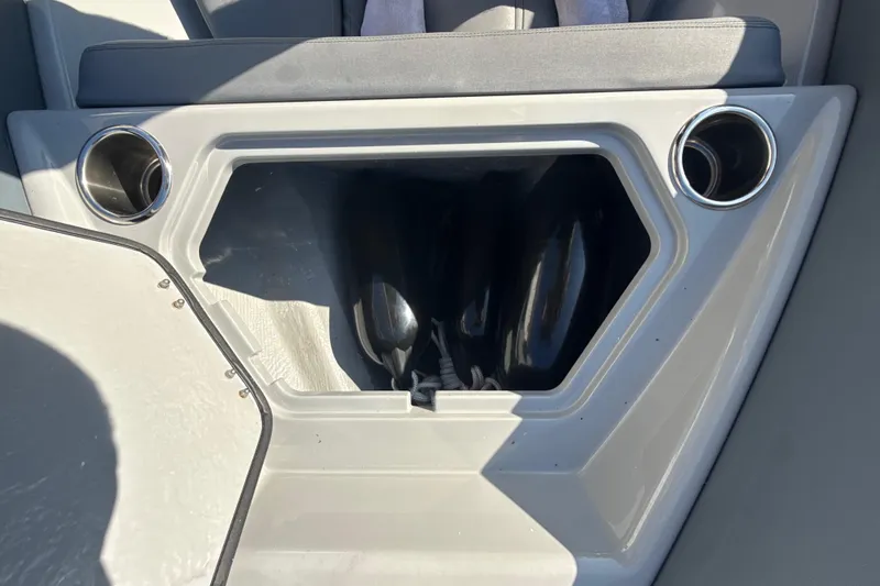 Slide: The Image of Ribeye HFM 2022 boat on trailer, parked beside a house with palm trees. - 7