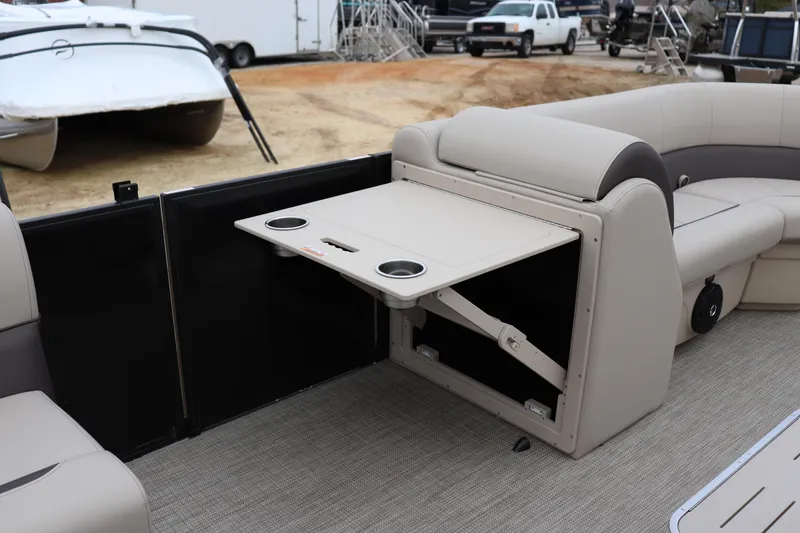 Slide: The Image of 2026 Bentley Pontoons Legacy 223 Cruise interior with foldable table and cup holders. - 6