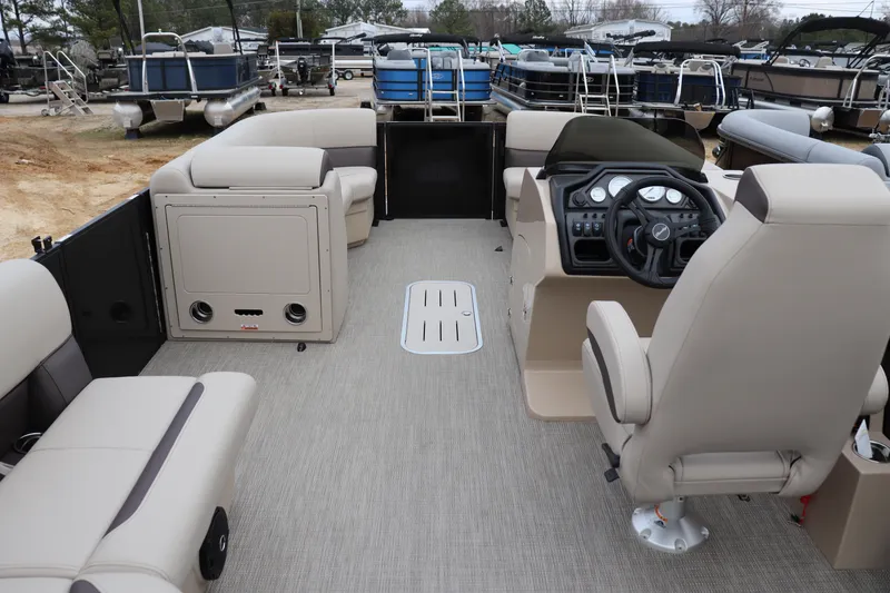 Slide: The Image of 2026 Bentley Pontoons Legacy 223 Cruise interior with beige seating and modern dashboard. - 8