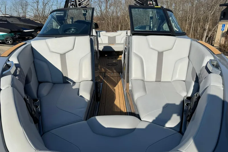 Slide: The Image of 2023 MasterCraft XT23 boat interior with luxurious seating and modern design. - 6