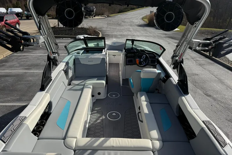 Slide: The Image of 2023 MasterCraft NXT23 boat interior with spacious seating and modern design. - 10