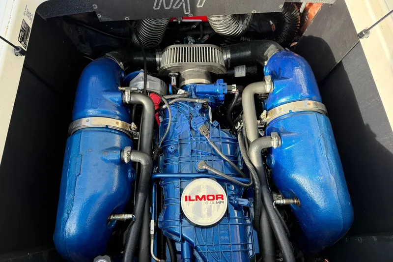 Slide: The Image of 2023 MasterCraft NXT23 engine compartment featuring Ilmor 6.0L MPI engine. - 11