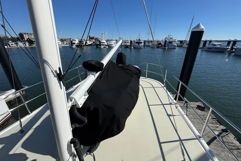 Slide: The Image of 2008 Kadey-Krogen 44 Walk Around yacht docked at marina, clear blue sky. - 17