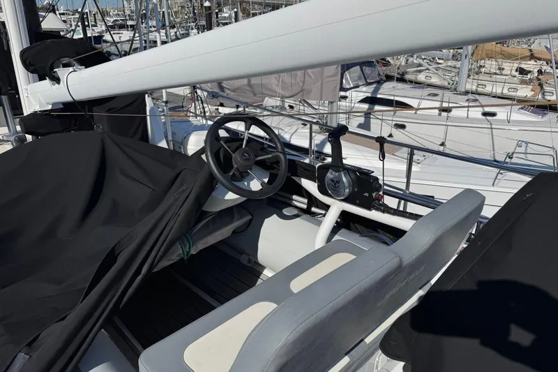 Slide: The Image of Helm of 2008 Kadey-Krogen 44 Walk Around yacht in marina setting. - 18