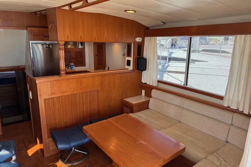 Slide: The Image of Luxurious 2008 Kadey-Krogen 44 Walk Around yacht interior with wood finishes and comfortable seating. - 29