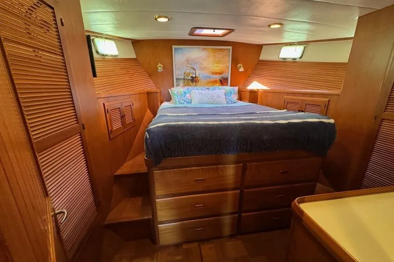 Slide: The Image of Luxurious 2008 Kadey-Krogen 44 Walk Around yacht bedroom with wood finish and cozy bedding. - 37