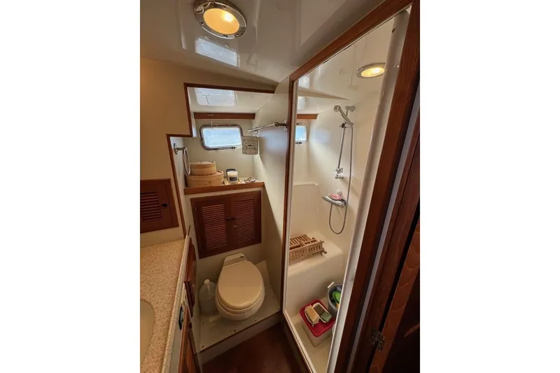 Slide: The Image of 2008 Kadey-Krogen 44 Walk Around yacht bathroom with shower and toilet. - 42