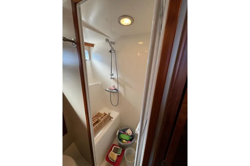 Slide: The Image of Compact shower area in a 2008 Kadey-Krogen 44 Walk Around yacht bathroom. - 43