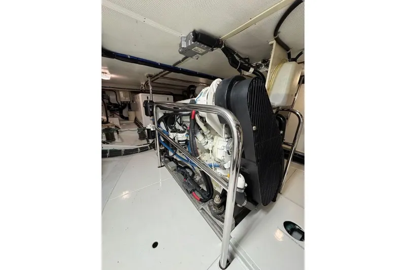Slide: The Image of Engine room of 2008 Kadey-Krogen 44 Walk Around yacht, showcasing mechanical components. - 53