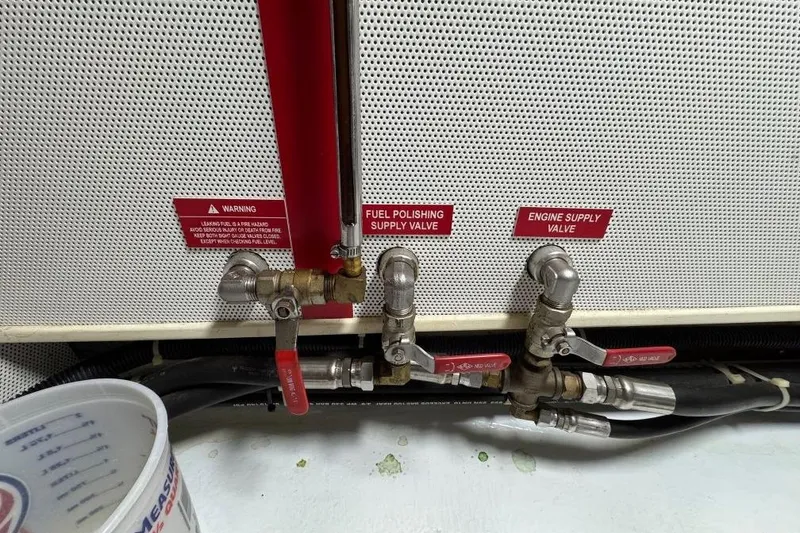 Slide: The Image of Fuel valves and warning labels on a 2008 Kadey-Krogen 44 Walk around boat. - 58