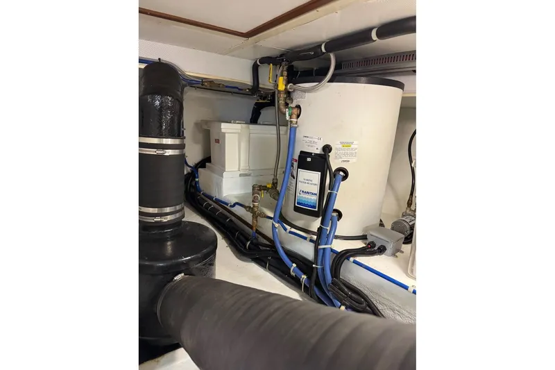 Slide: The Image of Engine room of 2008 Kadey-Krogen 44 Walk Around with plumbing and equipment. - 62