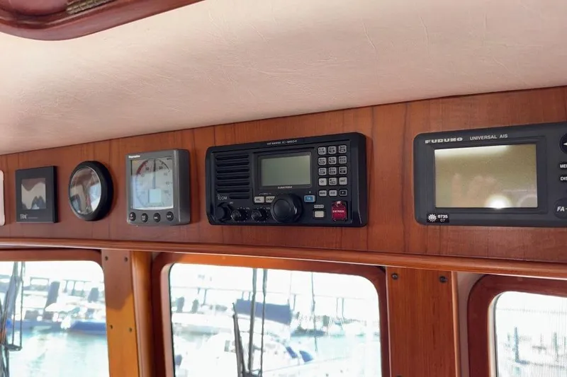 Slide: The Image of Control panel of a 2008 Kadey-Krogen 44 Walk Around yacht with navigation instruments. - 70