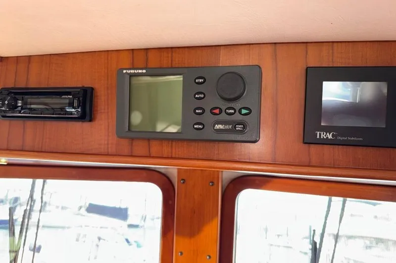Slide: The Image of Control panel of a 2008 Kadey-Krogen 44 Walk Around yacht with navigation equipment. - 72
