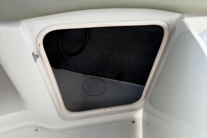 Slide: The Image of Storage compartment on a 2005 Sea Ray 220 Sundeck boat. - 14