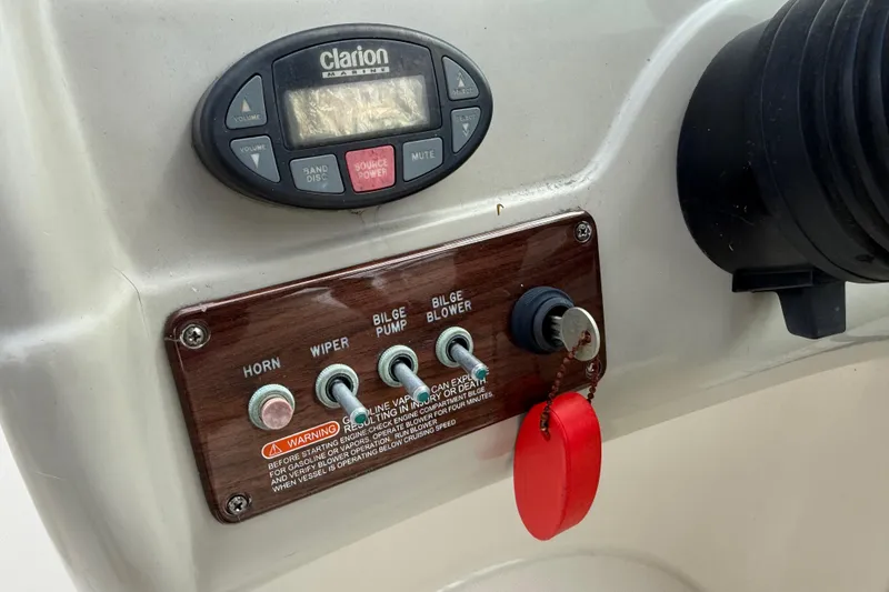 Slide: The Image of Control panel of a 2005 Sea Ray 220 Sundeck with Clarion marine stereo. - 22