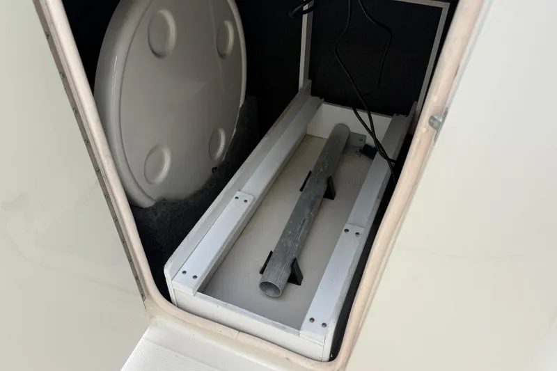 Slide: The Image of Storage compartment in a 2005 Sea Ray 220 Sundeck boat. - 25