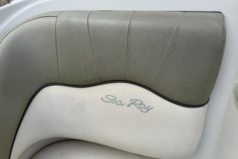 Slide: The Image of Close-up of 2005 Sea Ray 220 Sundeck boat seat with logo. - 30