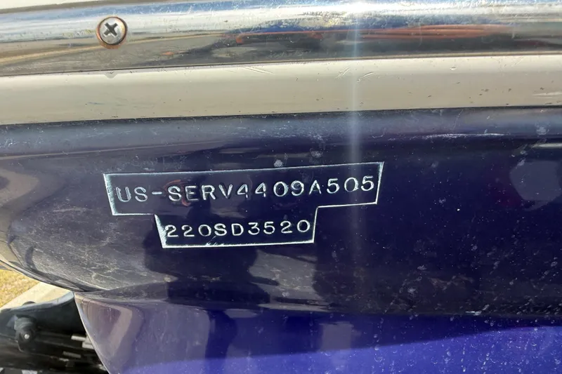 Slide: The Image of 2005 Sea Ray 220 Sundeck boat hull identification number close-up. - 32