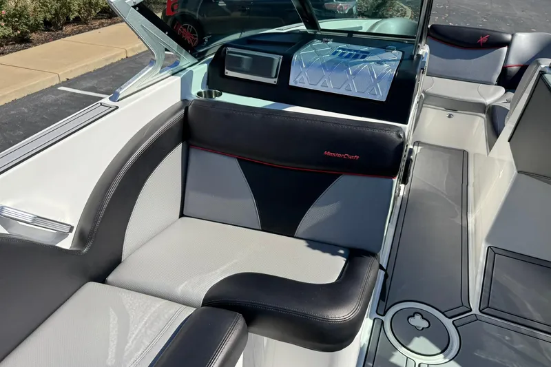 Slide: The Image of 2016 MasterCraft X23 boat interior with sleek seating and modern design. - 10