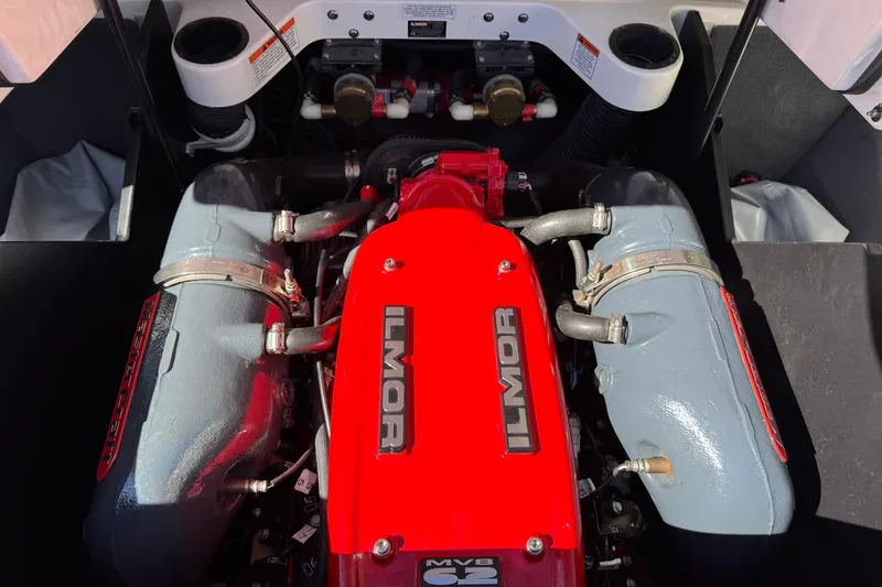 Slide: The Image of 2016 MasterCraft X23 Ilmor engine, vibrant red and gray components, detailed view. - 12