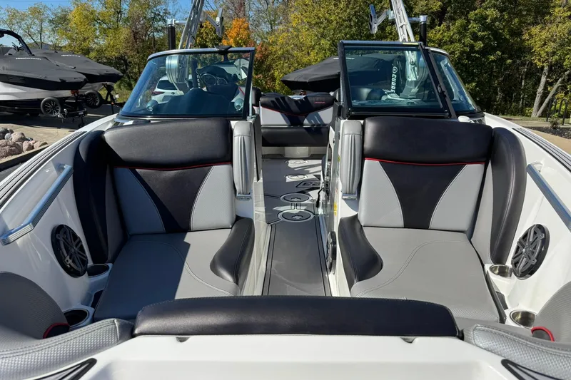 Slide: The Image of 2016 MasterCraft X23 boat interior with sleek seating and modern design. - 7